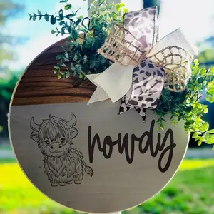 Howdy Highland Cow Wooden Door Hanger with cow print Bow and Greenery for Rustic Home Decor