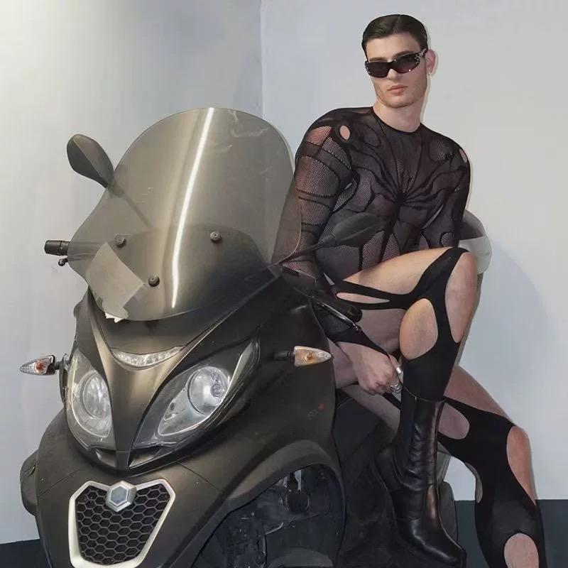 Illussy 2025 Edgy Men's Fishnet Bodysuit with Daring Cut-Outs & Easy-Access Opening. This provocative full-body mesh lingerie is designed to show off your physique, perfect for pride events, parties, or a bold night out. Embrace your confidence