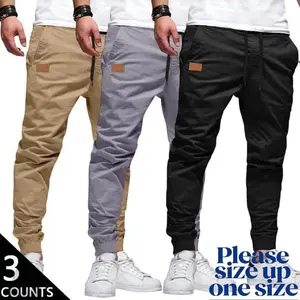 Men's 3-Pack Casual Jogger Pants - Khaki, Grey & Black Colors - Elastic Waist with Drawstring, Ribbed Cuffs, PU Patch Detail - Lightweight 100% Polyester Fabric - Perfect for Streetwear, Travel, Daily Wear - S-3XL Sizes We recommend buying one size up.