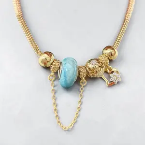 Women's 14k Gold Plated Charm Bracelet 7 Inches with Blue Bead and Heart Charm