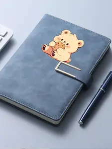 This notebook features a cartoon bear eating a cookie design and is suitable for school and office use.
