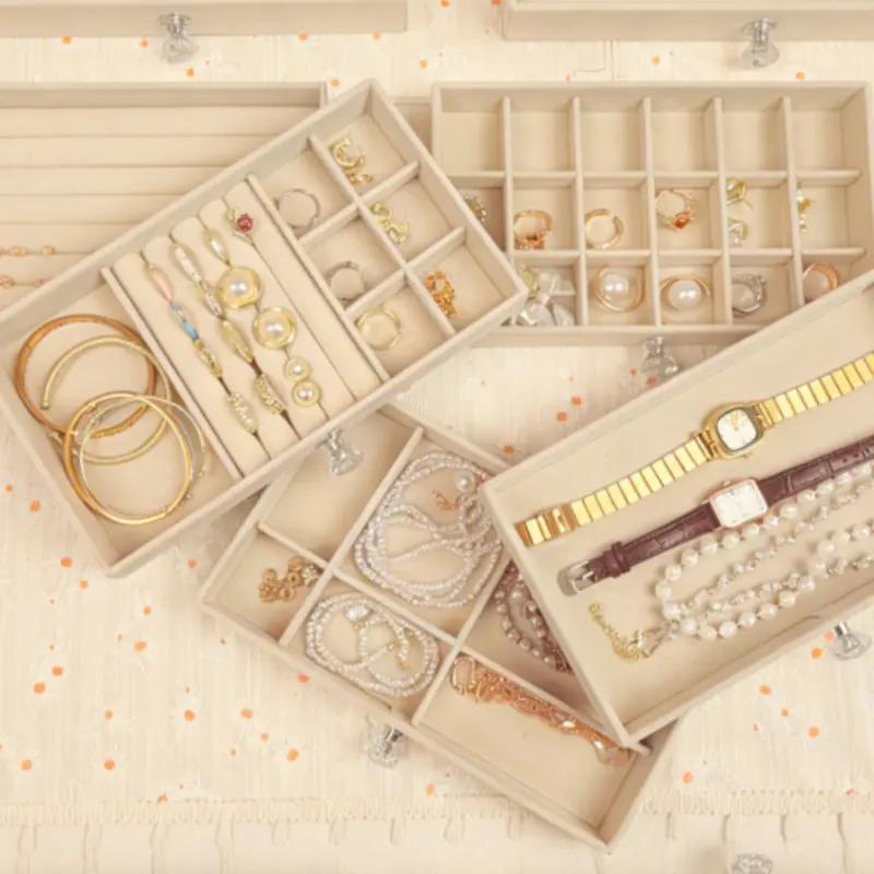 A set of 5 acrylic jewelry storage boxes with transparent downy velvet lining, featuring a stackable design and detachable dividers, suitable for earrings, necklaces, rings and bracelets, as well as a display box for women's makeup tables.
