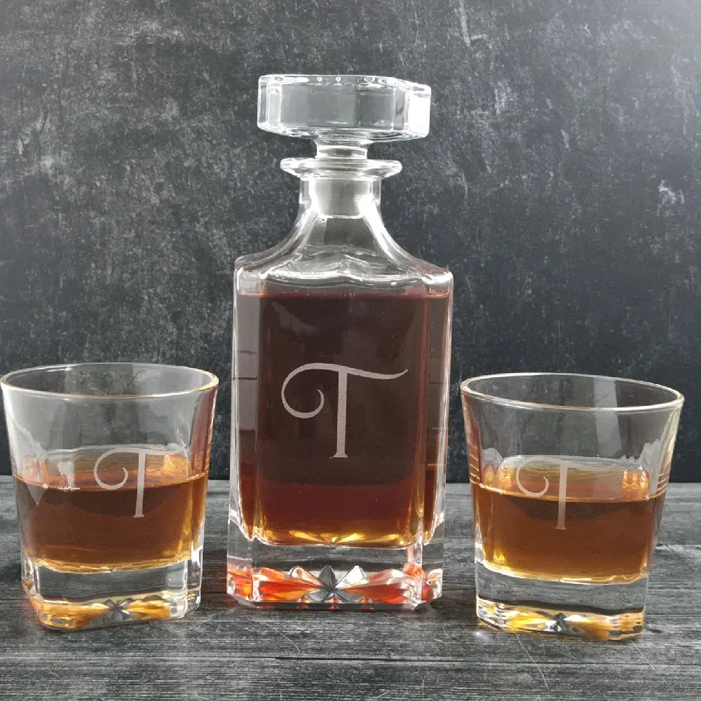 Custom Decanter set with two or four whiskey glasses.  Presented in a wood box with a hinged lid.  Box colors are walnut or black.