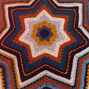 6 Day Star Challenge Blanket - Colorful Star Pattern with Orange and Blue Accents, Featuring Intricate Design Elements