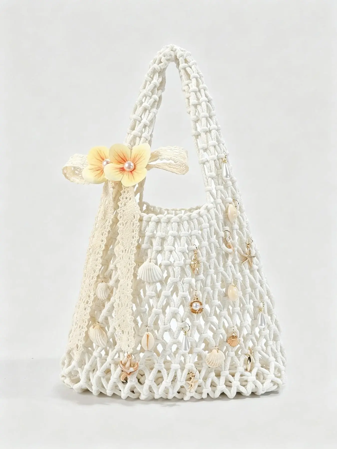 Fashionable vacation style woven hollow hand-held bag, Summer Handbag, decorated with flowers, starfish, shells, and pearls, featuring a conch chain design, versatile for seaside travel, sweet and simple casual style Chic Beach Purse