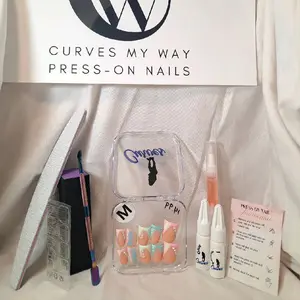 "CMW Press-On Nails — Size Medium Only. These stunning duckbill-shaped press-ons blend soft peach with pastel mint and baby blue accents. Delicate rhinestone detailing and cherry blossom art add a whimsical charm. Easy to apply and designed for a perfect