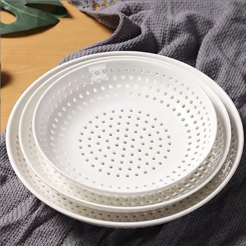 White plastic steaming plate, jiaozi plate, steamed steamed stuffed bun steamed seafood drain plate, round perforated steamer fruit plate microwave oven.