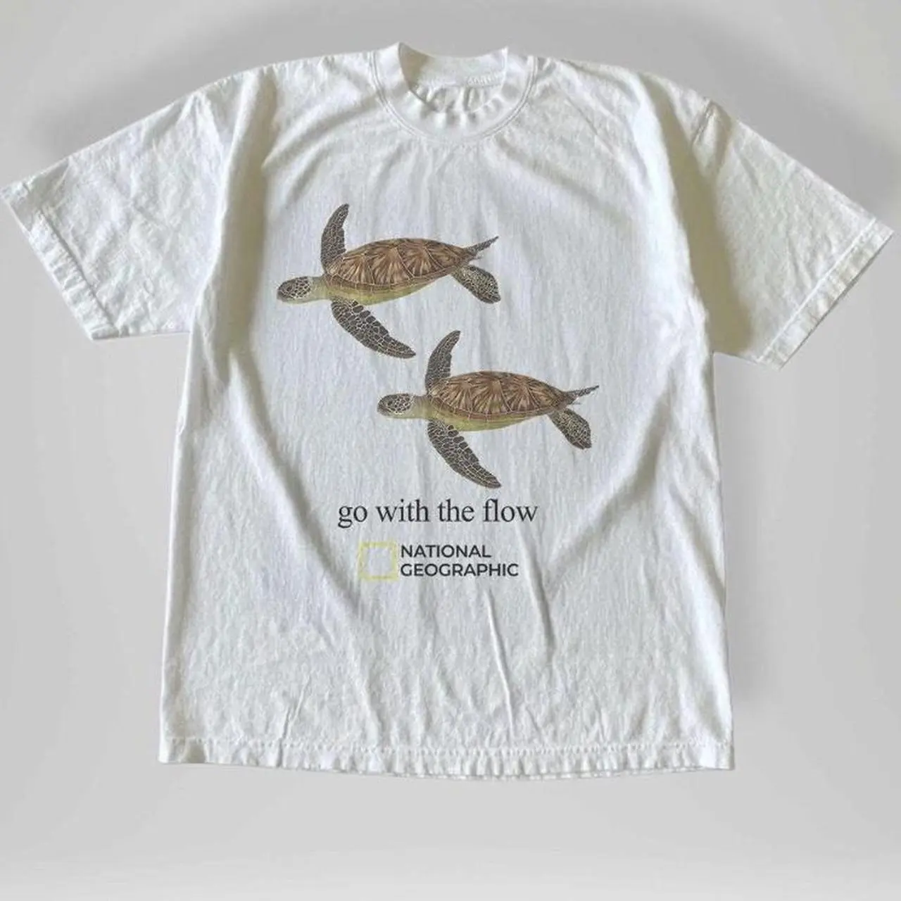 Gildan Men's and Women's T-shirt, National Geographic turtle  go with the flow  tee, Animal tee, Y2k Unisex Graphic Tees Gothic Grunge Emo Scene Amity Affliction Style Clothes Menswear Womenswear Streetwear