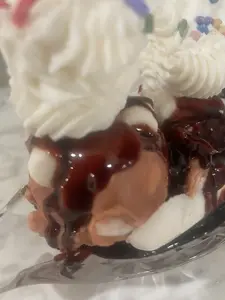 Hot Fudge Banana Split with Creamy Ice Cream Topped with Rich Chocolate Sauce and Whipped Cream