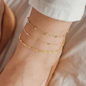 New fashionable and versatile round bead flat snake chain three-piece set, simple multi-layer anklet set for women.