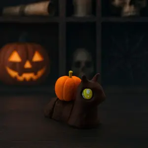 Mini Articulated Pumpkin Snail Handmade 3D Printed Design with Glossy Brown Body Yellow Eyes & Bright Orange Shell Perfect for Gothic Décor and Spooky Shelf Buddy