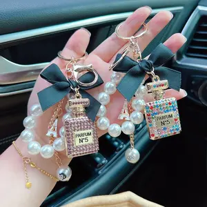 Bling Bowknot Perfume Bottle Keychain with Pearl Chain Alloy Rhinestone Car Key Ring Bag Pendant Charm Accessory Cute Gift for Girls and Women Handbag Decoration carscent