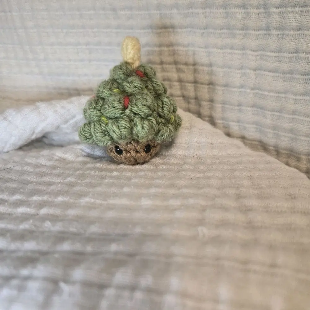 Handcrafted Crochet Christmas Tree Pop Fidget with Festive Green Yarn and Colorful Berries