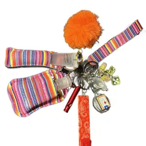 Rainbow Keychain with Colorful Striped Design and Orange Pom Pom Accessory