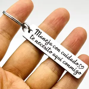 A Spanish-style keychain with a heart-shaped pattern - featuring the words "Safe Driving", on the keychain.