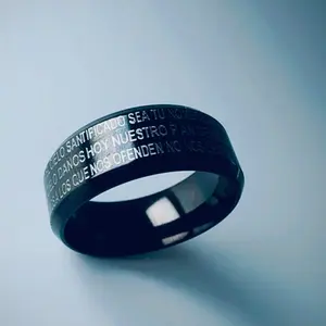 Elegant Black stainless steel ring features the Lord's Prayer engraved in Spanish, divided by a small Cross symbolizing faith and protection. Made from high-quality, tarnish-resistant steel, it combines durability with sleek, modern style