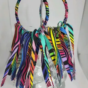 Mulit colored tassel hoop earrings.