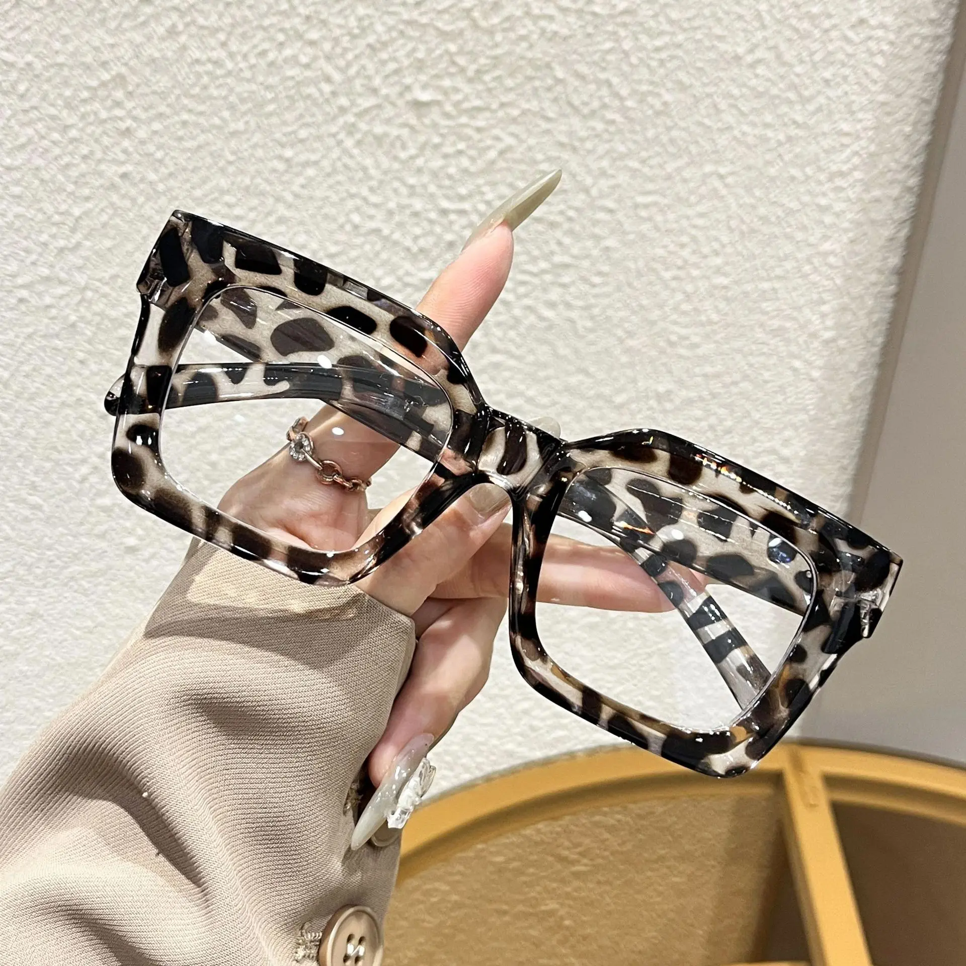 White leopard print frame, white flat