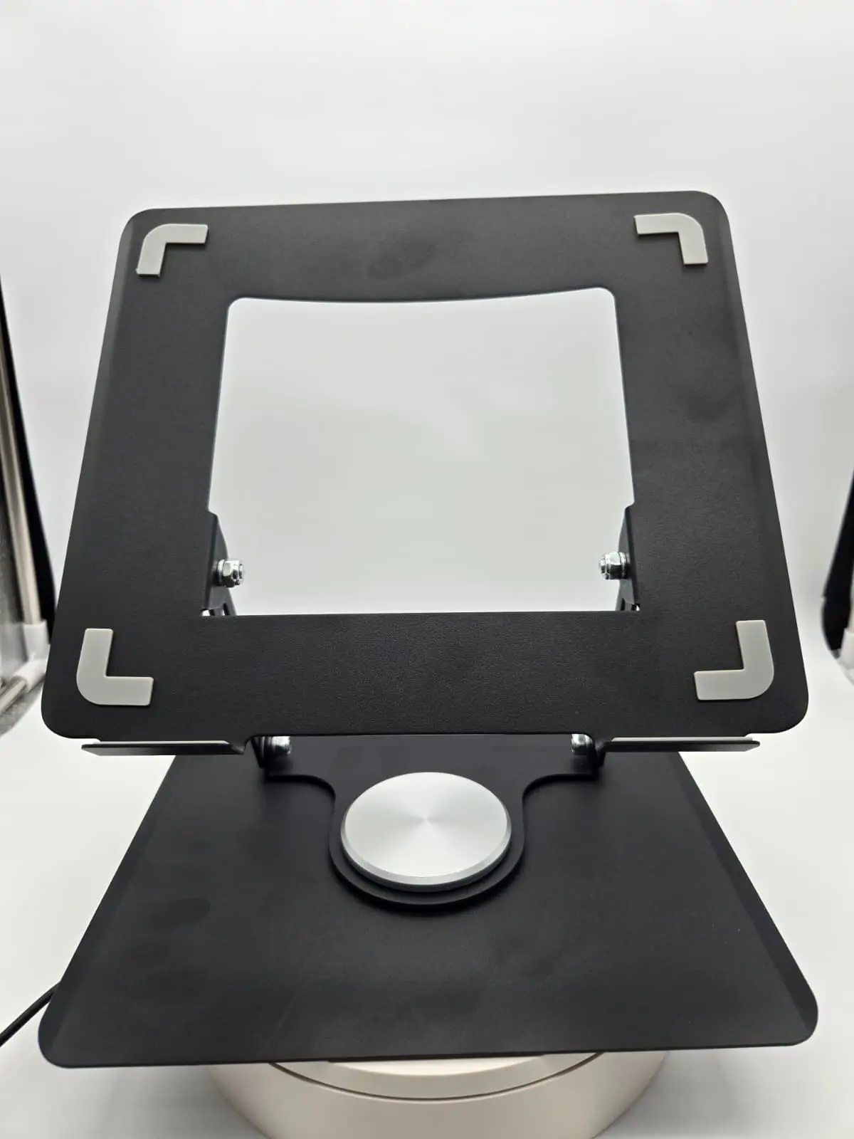 Adjustable Laptop Stand with Secure Mounting Brackets and Central Support Base for Optimal Viewing Angle