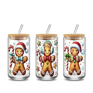 Cute Christmas Gingerbread Man 16oz covered straw glass drinking cup, Tumbler with lid, reusable glass drinking cup, glass jar design, suitable for iced coffee, cold drink glass cups, glassware. Perfect gift for coffee lover