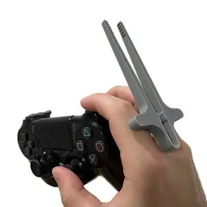 Gamer Chopsticks That Attach To Fingers To Keep Your Controller And Fingers Clean While Snacking During A Game