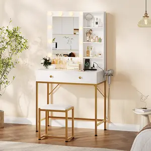 Brighten your beauty routine with this white and gold wall-mounted vanity desk. It features two drawers, a dimmable LED mirror with three color modes, and a built-in blow dryer holder.