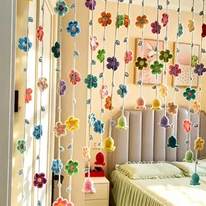 A charming hand-crocheted wreath; a knitted door curtain in soft, pastel shades perfect for a young girl’s bedroom; decorative drapes; and ethereal, fairy-inspired decor.