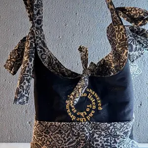 Bow Book Bag Tote with Elegant Paisley Design and Unique Embroidery Features