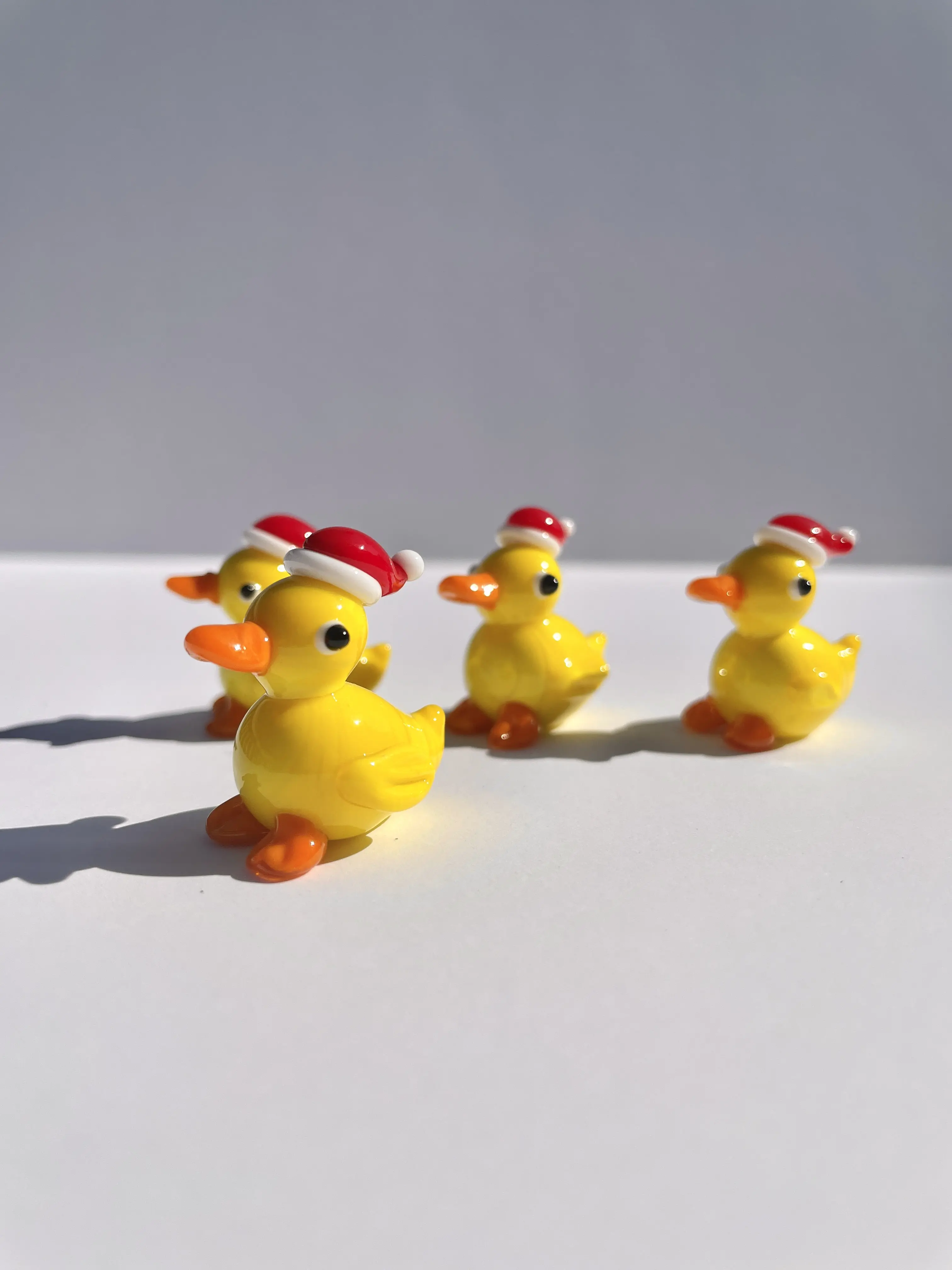 Handmade blown glass yellow duck with Christmas hat| handmade fused glass figurines| glass miniature Christmas tree holiday decor, mini duck