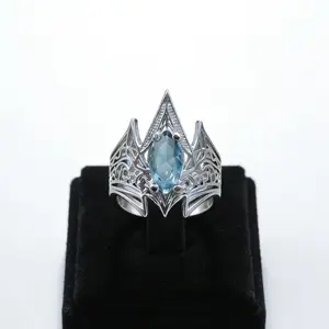 Trident Crown Hollow-out Ring, with a retro fantasy style, inlaid with aquamarine synthetic zircon, a courtly retro accessory, featuring a wide band design, a silver-plated textured ring that balances toughness and delicacy. A holiday present for him.