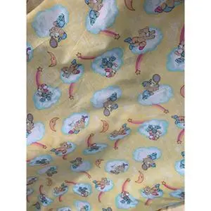 Beautiful cotton kids print, pastel yellow base with bear on the clouds pattern. Best used for apparel and home Decore. Sold by the yard