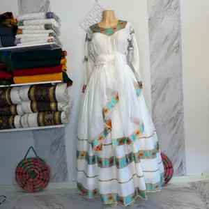 Elegant White Long Dress with Colorful Embroidery and Long Sleeves for Special Occasions እጅ ጥልፉ