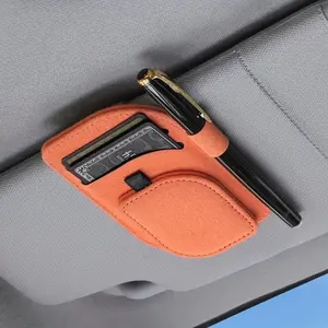 Magnetic car glasses frame and card storage device - One-handed pick-up/removal of fashionable glasses cases, supports hands-free cigarette lighter operation, dashboard/instrument panel installation