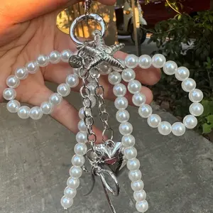 Niche design exquisite pearl string keychain, metal bow starfish pendant, sweet and fashionable pearl bow silver heart pendant car keychain pendant versatile bag pendant, shoulder bag crossbody bag small item keychain pendant