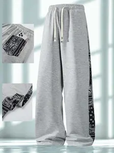 High-waisted streetwear color-block sweatpants made from heavyweight pure cotton with a drapey feel, featuring a wide leg, drawstring waist, and pockets at the waistband