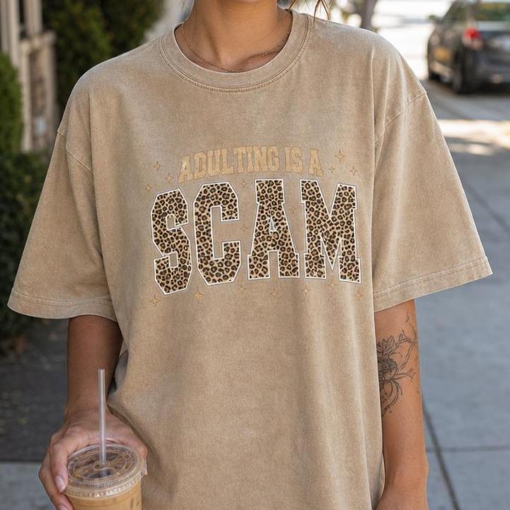 Women's Leopard Print Round Neck Oversized Loose-Fit T-Shirt - Casual Streetwear Top with Funny Quote "Adulting Is A Scam"