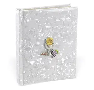 Child of God White pearlized Communion Book with Chalice Medal on the cover.