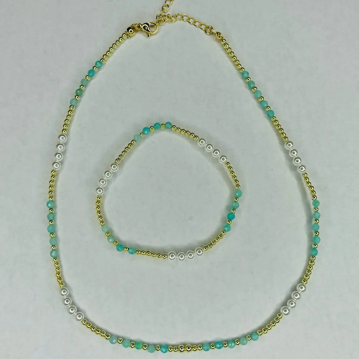The Peruvian Amazonite Set This jewelry set is a perfect combination of elegance and simplicity. The bracelet is 6.5 inches and is made with 3mm gold plated hematite gemstone beads