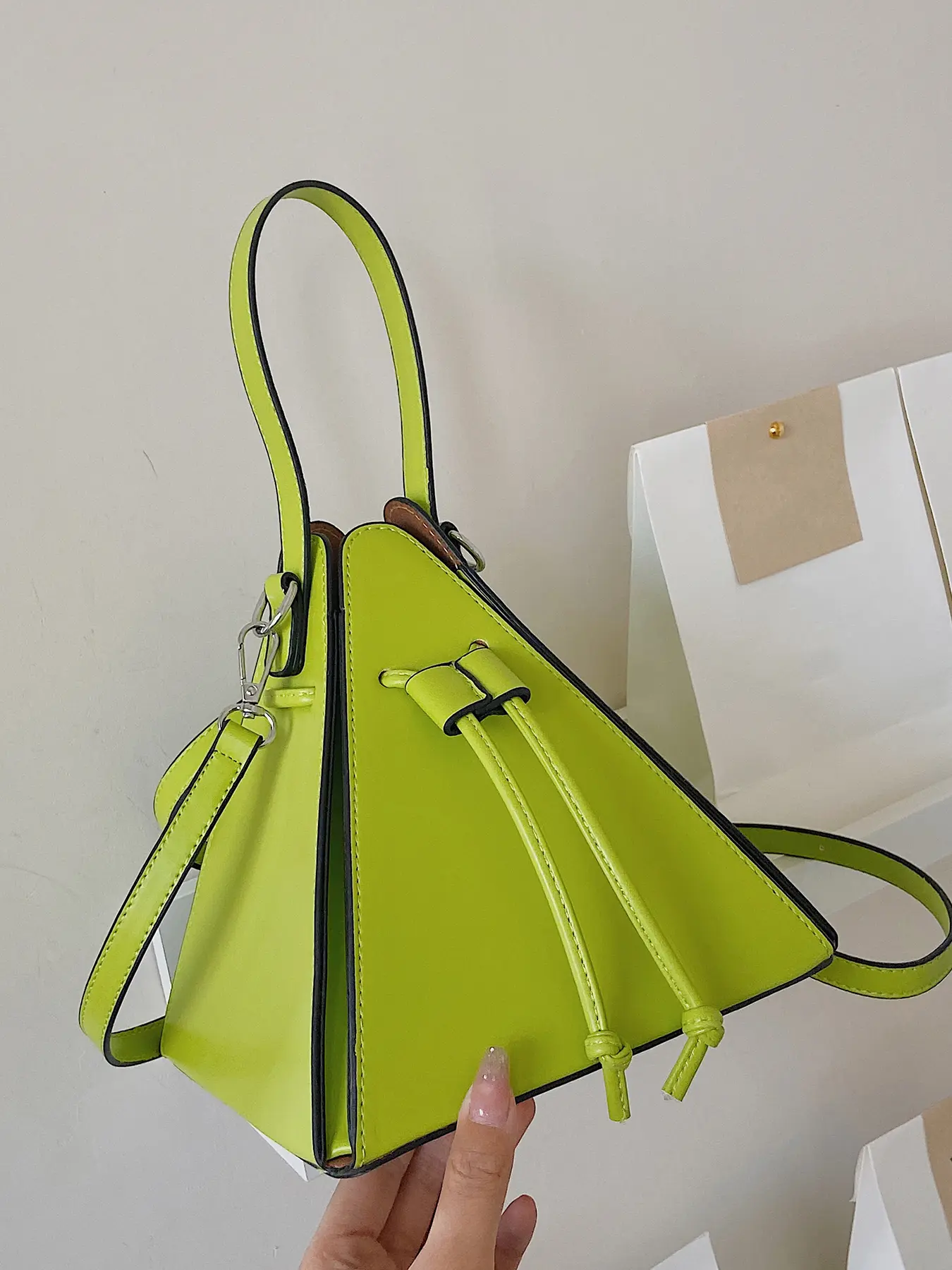 Geometric design bag, with intricate decorative details and drawstring design, it is a versatile and compact carry on crossbody bag, Versatile shoulder bags, suitable for socializing, parties, and photography