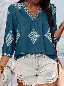 A women's geometric print V-neck, three-quarter sleeve loose-fitting Blouse shirt with an Elegant beachy vibe that flatters the figure and is versatile.