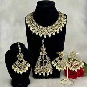 Gorgeous Bridal Gold Statement Necklace Earrings Tikka And Jhumar Jewelry Set with Pearl Accents and Elegant Design