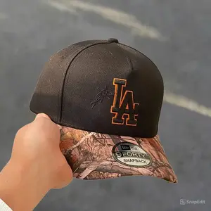 New Era Los Angeles Dodgers 9FORTY Snapback Cap with Realtree Camo print.