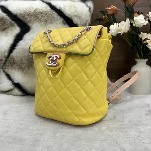 Pre-owned CHANEL Cruise Collection Runway Piece: Yellow Calfskin Quilted Backpack with Rainbow Eyelets 866