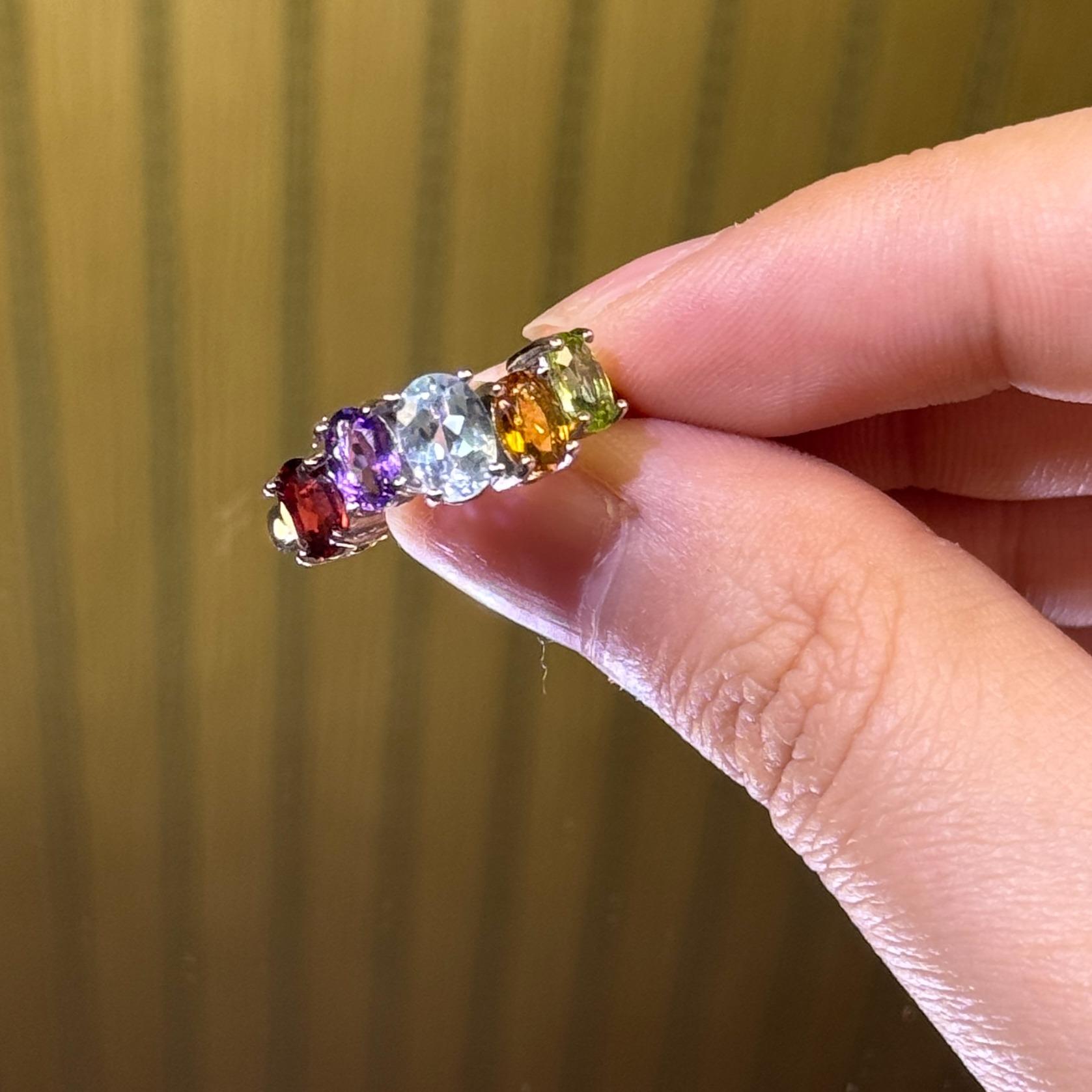 Titanium steel rings featuring natural blue sapphire, amethyst, citrine, olive stone, and pomegranate stone—oval, fashionable, and refined jewelry.