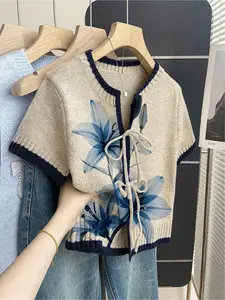 Women's khaki bohemian vacation short-sleeve knit top Casual Comfy Fit. Loose round neck, blue gradient floral print, front tie and contrast piping. Ideal for spring & summer casual wear.