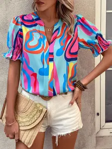 A women's colorful abstract print chiffon blouse with puff sleeves, featuring a bright vintage summer style, V-neck opening, and short puff sleeves, suitable for vacation trips and casual everyday wear.