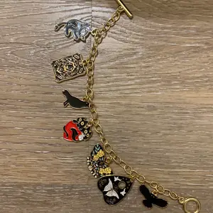 Strength Charm Bracelet with Assorted Charms Featuring Animal Illustrations and Decorative Elements