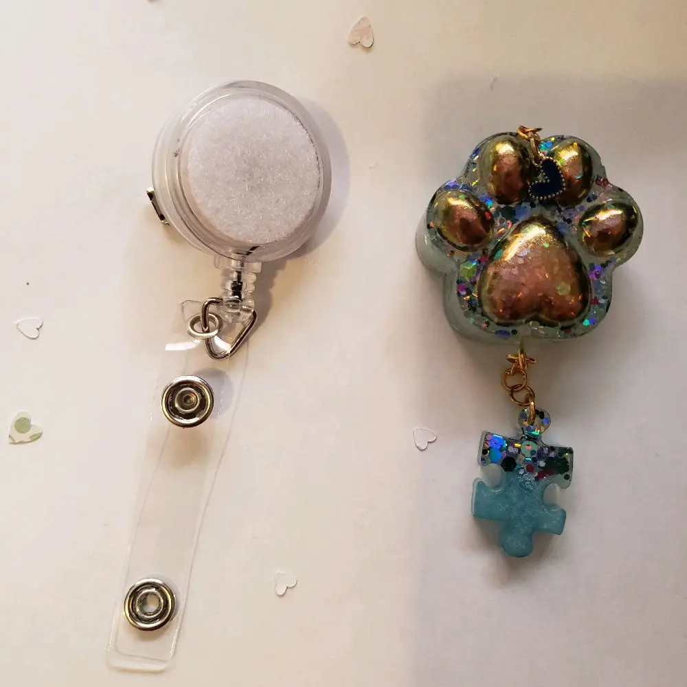 Blue Glitter Paw Retractable Badge with Small Heart Charm and Blue Glitter Puzzle Part Attachment