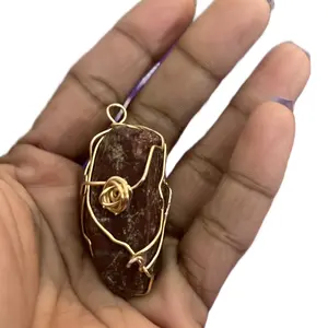 Raw ruby healing stone wrapped in wire