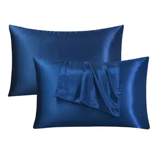 A set of two sapphire blue and navy blue [rayon] pillowcases, designed to complement silk bedding; ideal for promoting restful sleep and hair care, offering a soft, skin-friendly feel and a touch of luxury to your home décor